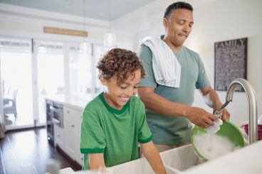 kid-doing-chores-with-dad